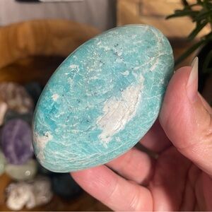 Large amazonite polished palm stone with Schiller